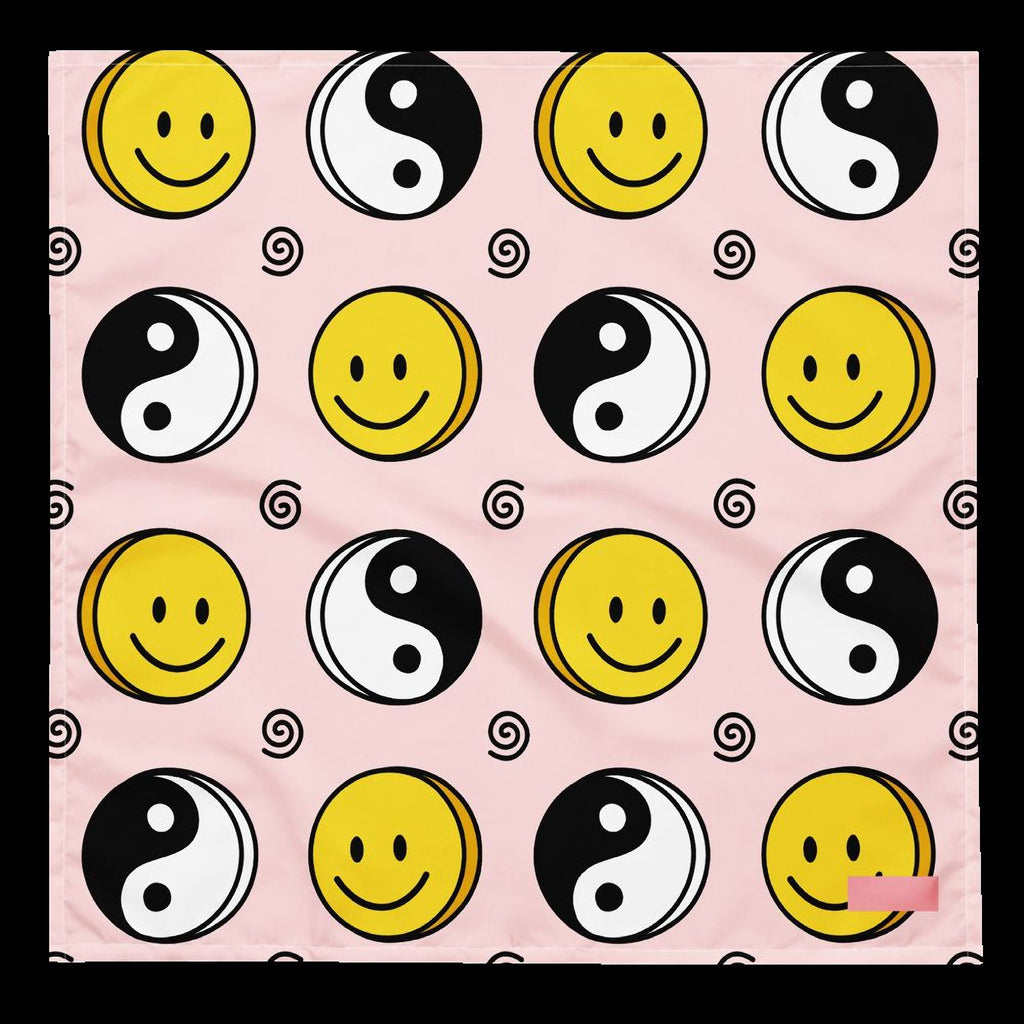 a repeating pattern of smiling and yin-yang symbols on a pink background.