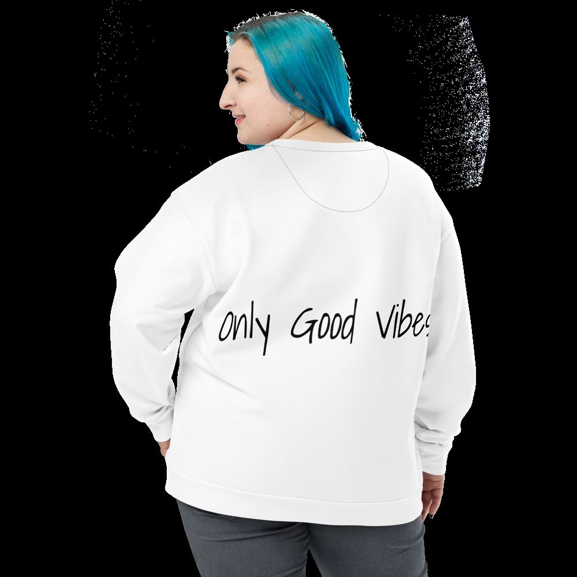 A person with blue hair wearing a white sweatshirt with the text "only Good Vibes" printed on it.