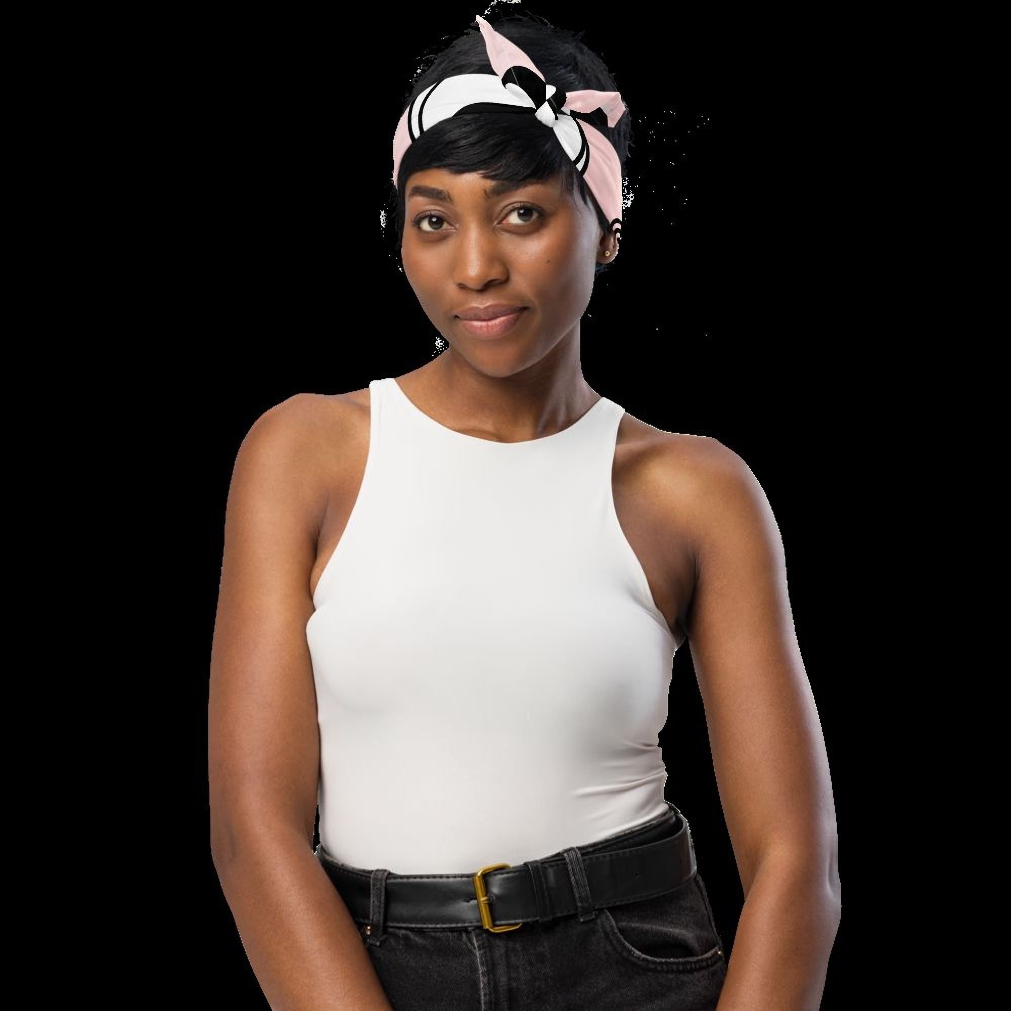 A woman wearing a white tank top and a pink and white headband stands against a black background.