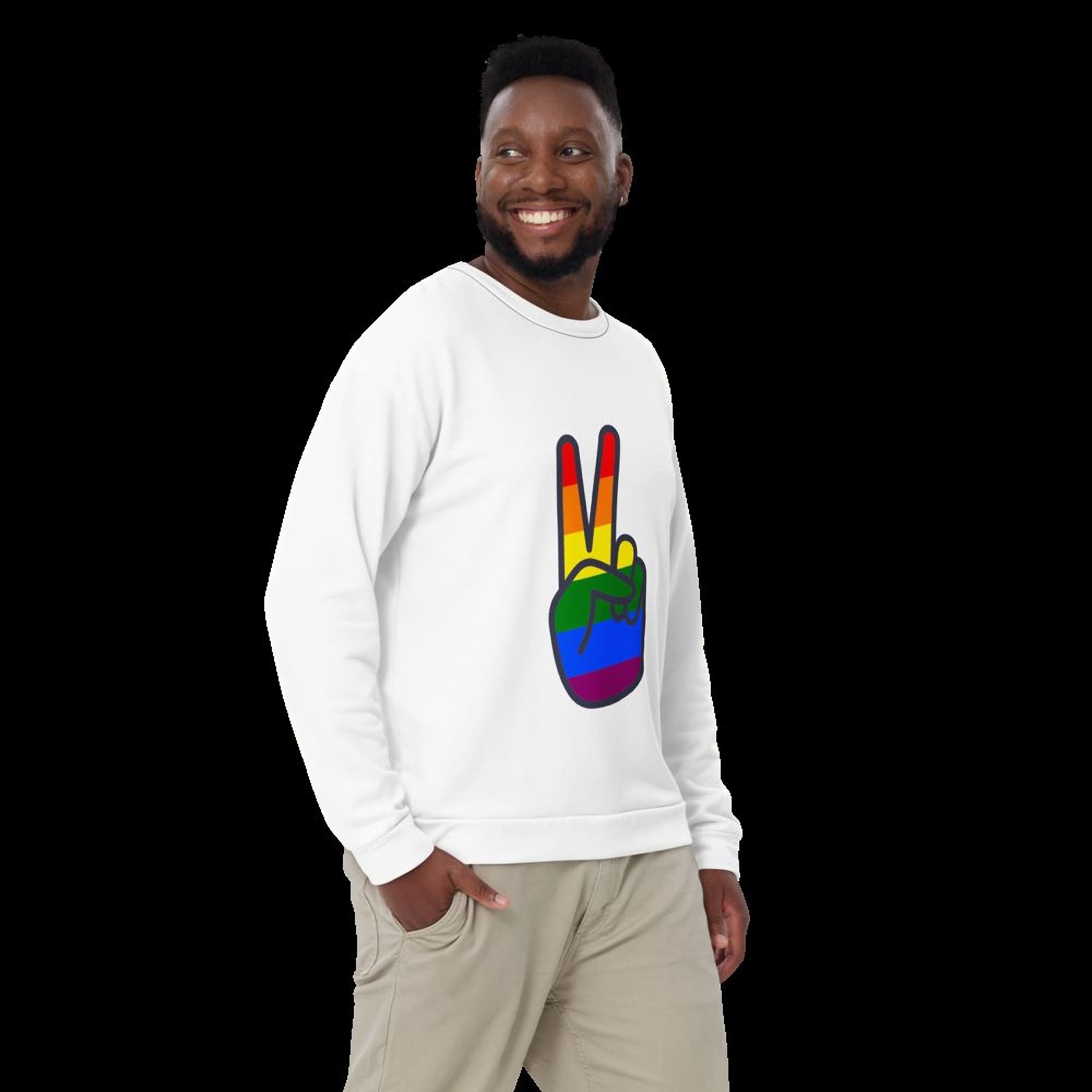 A smiling man wearing a white sweatshirt with a peace sign graphic on it.