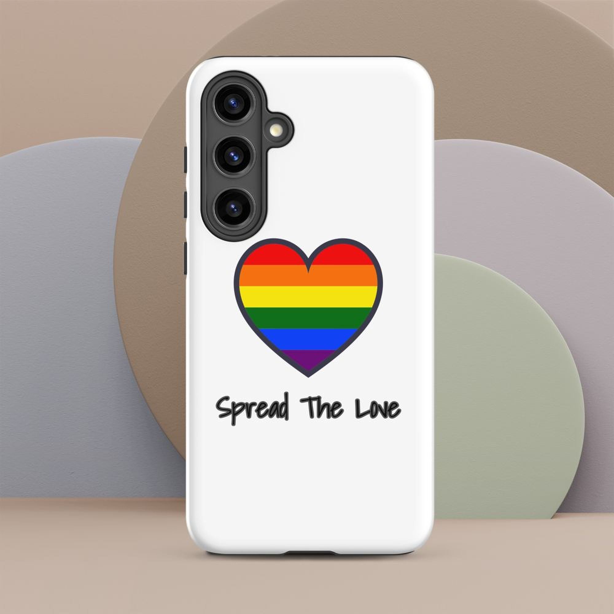 A white phone case with a rainbow heart symbol and the text "Spread The Love" printed on it.