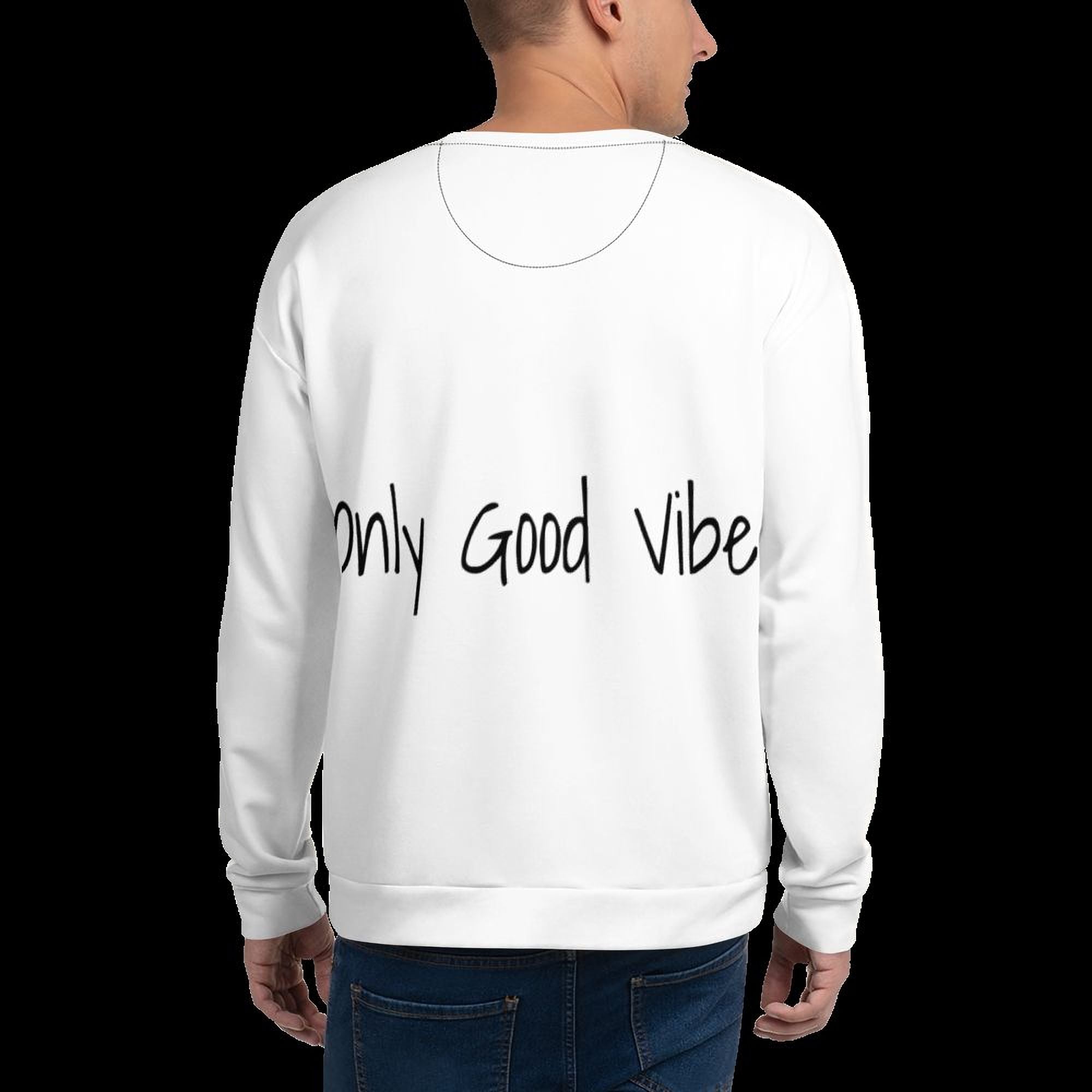 A person wearing a white sweatshirt with the text "Only Good Vibe" printed on the back.