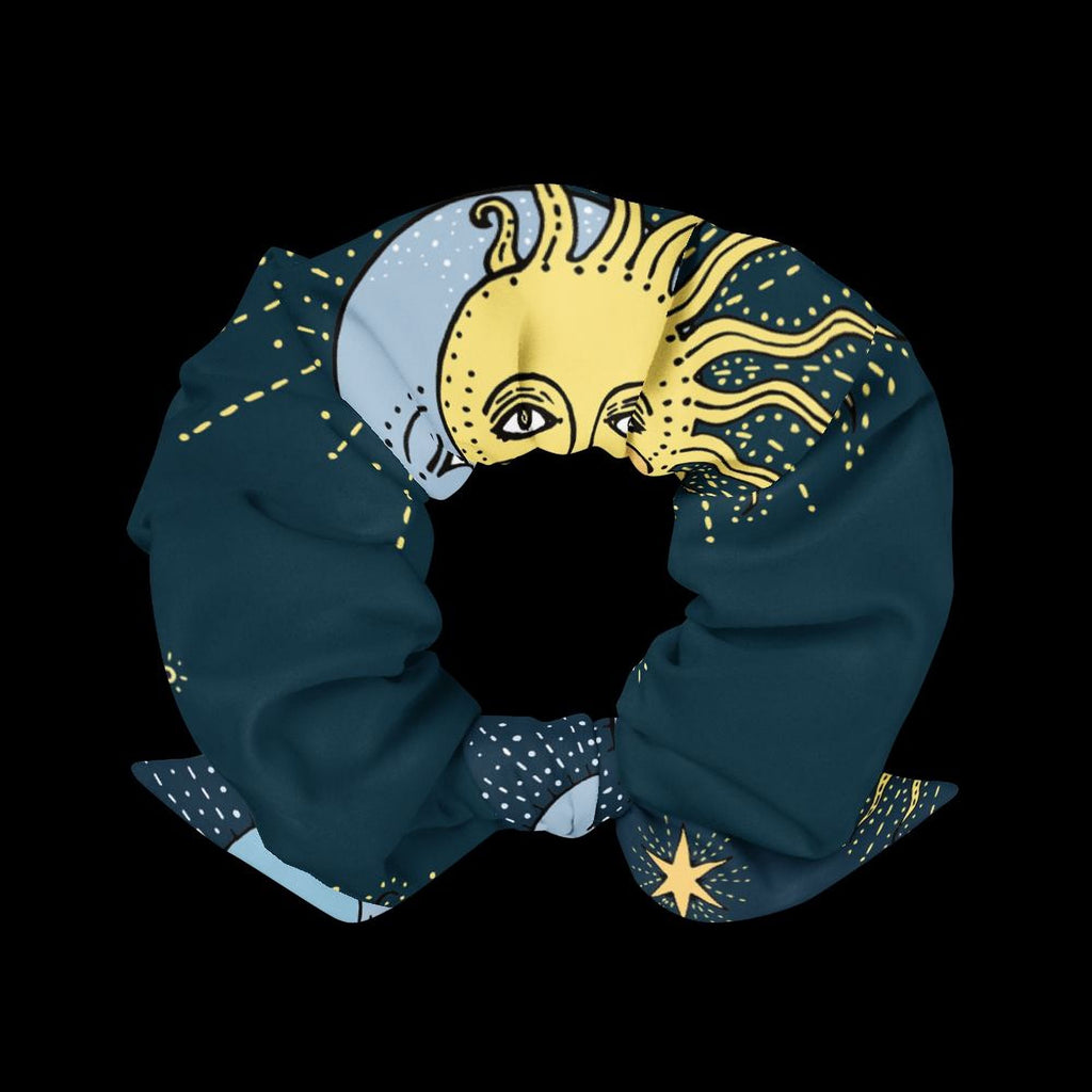A blue scarf with a sun and moon design, featuring a yellow sun and moon against a dark background.
