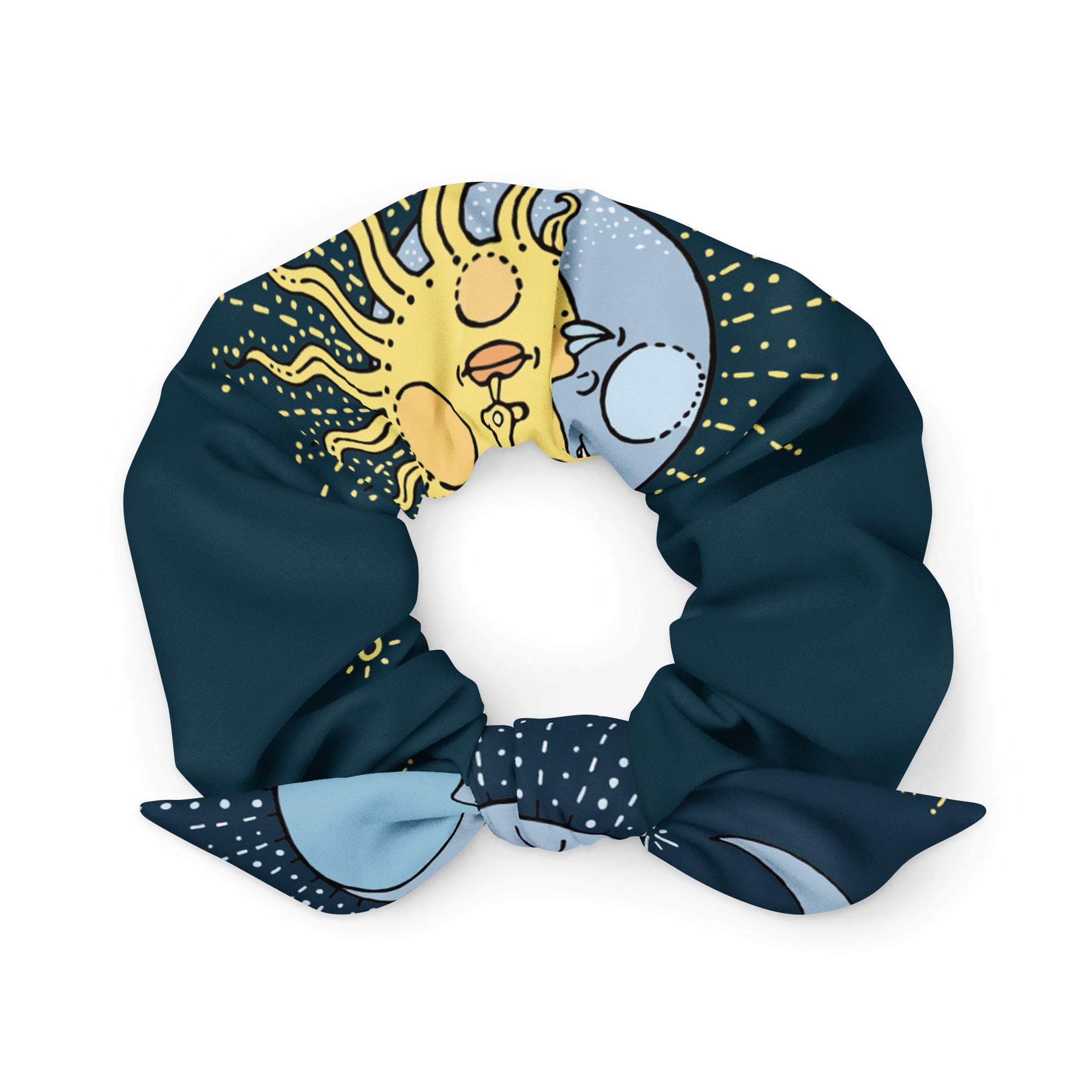 A blue and yellow patterned scrunchie with a sun and moon design.