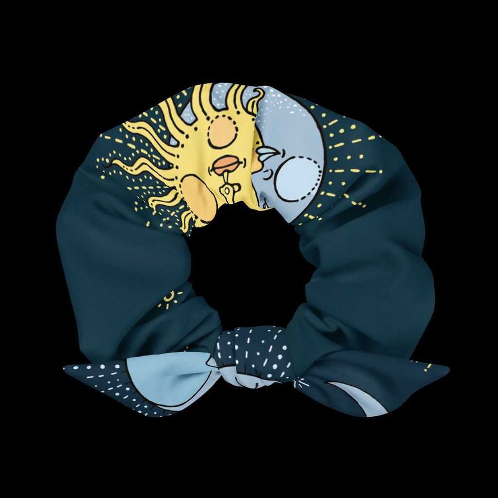 A colorful scarf with a sun and moon design, featuring a sun and moon motif with rays emanating from the sun.